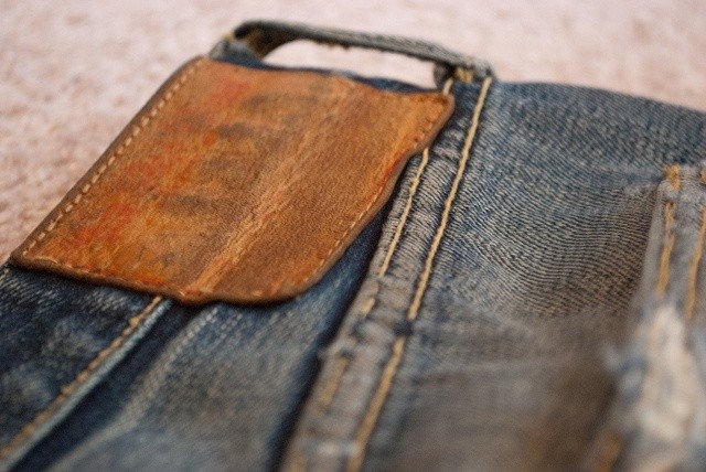 The World Tour jeans' leather patch after 4 years