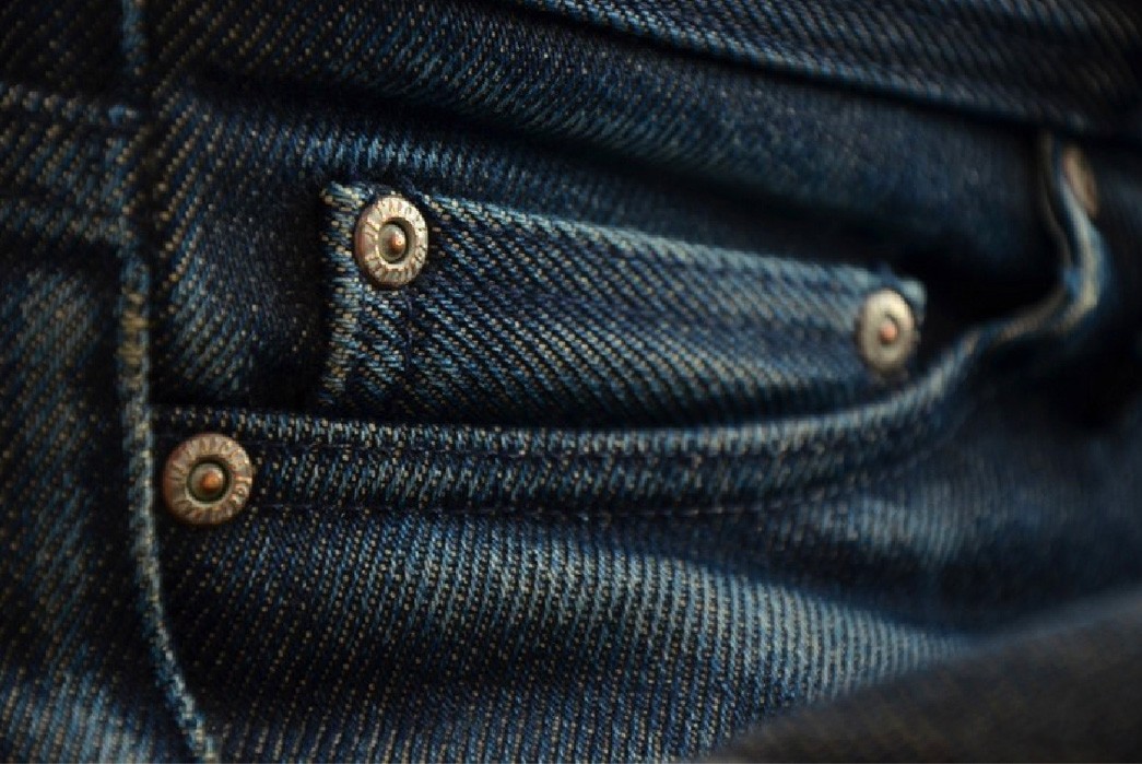 The selvedge detail is on the inside of the coin pocket (not shown). 