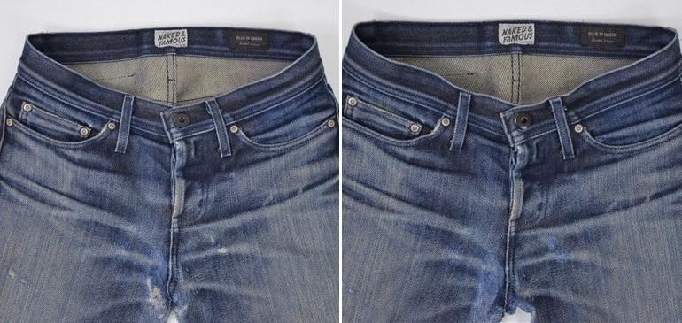 Front top of the jeans. The hole is located to the bottom right of the left pocket.