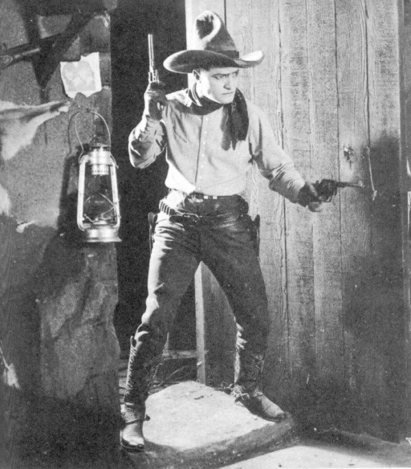 Western star Tom Mix wearing jeans in 