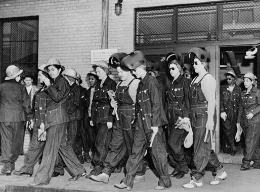 Denim-clad female workers leaving the factory.