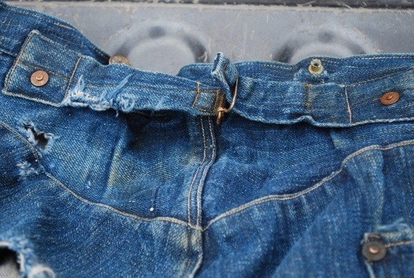 Most jeans produced before WWII had a cinching buckle across the back waist.