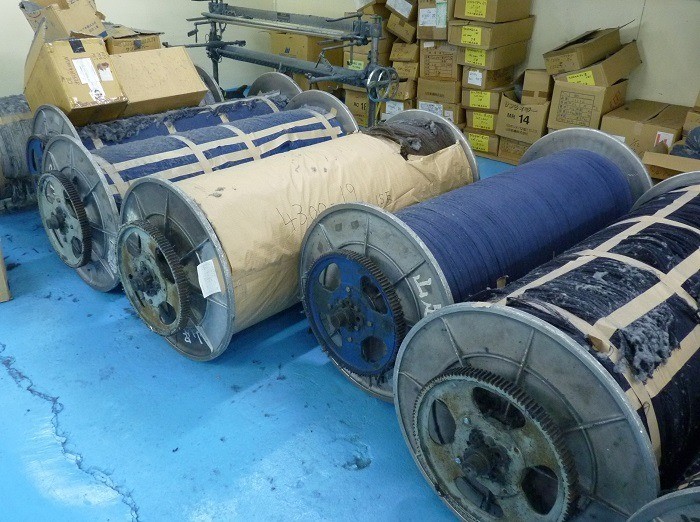 Spools of thread, waiting to be woven into fabric.