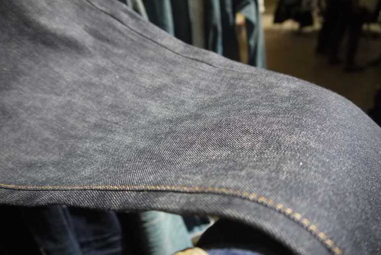 13.5 Oz. nearly iridescent indigo denim. If you look closely you can see the slightly green sheen.
