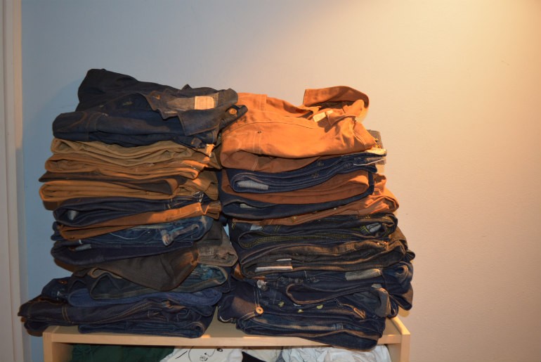 Stack of Denim and Duck, with a couple of shirts on top.