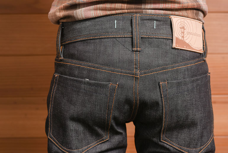 An upclose look the backside of oneculture's denim and 7x7 back pockets.