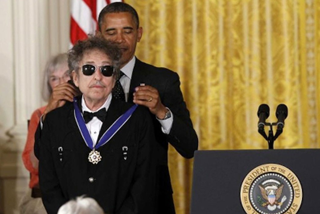 Bob Dylan receiving the US Medal of Freedom in a Rockmount solid white Pima cotton shirt with black diamond snaps.