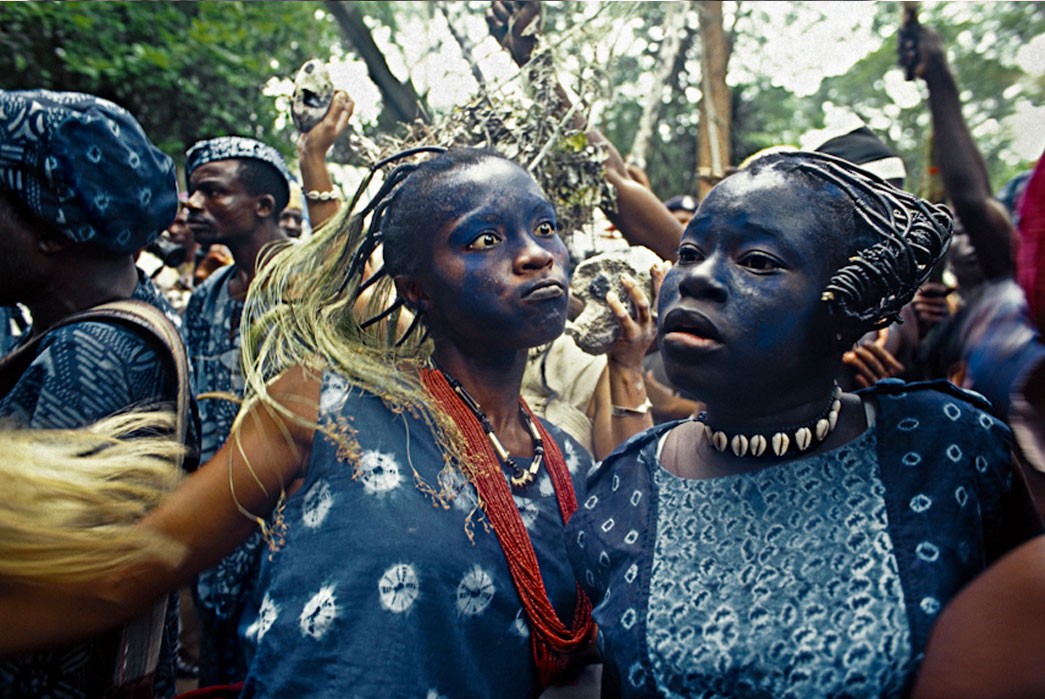Yoruba dancers in Nigeria with indigo dyed clothing and skin.