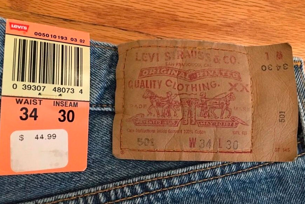 Deadstock pair of Levi's 501 c. 1993. Notice how the patch butts up against the belt loop on the right side. Image via eBay