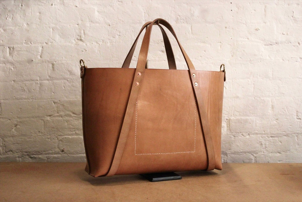 WholeCut Type II by Charlie Borrow. Hand stitched leather bag in Russet (un-dyed) bridle leather from Baker's Tannery in Devon. The body is cut from a single piece of leather. Image via Charlie Borrow