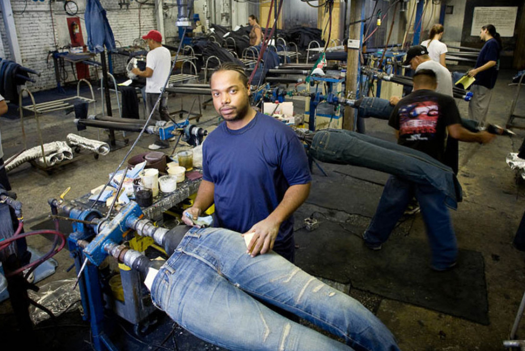 Made-in-USA-and-the-Rise-of-Nationalism-Workers-create-fake-fades-at-a-denim-wash-house-in-Kentucky.-Image-via-David-Friedman.