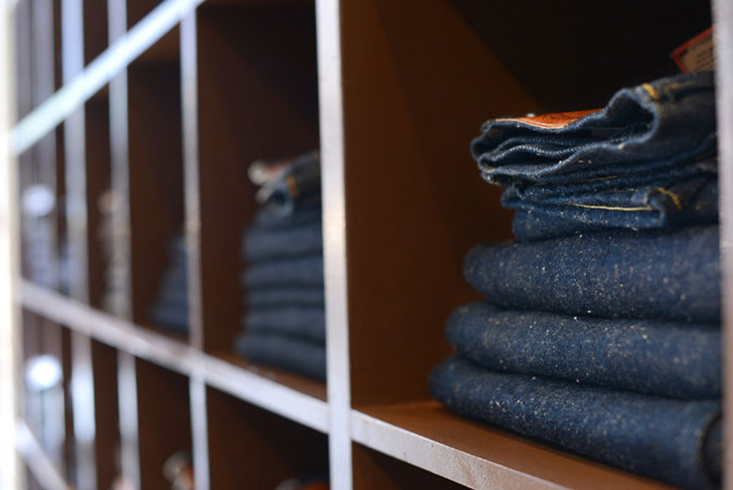 The wall of denim at Blue in Green. Image via NY Times.