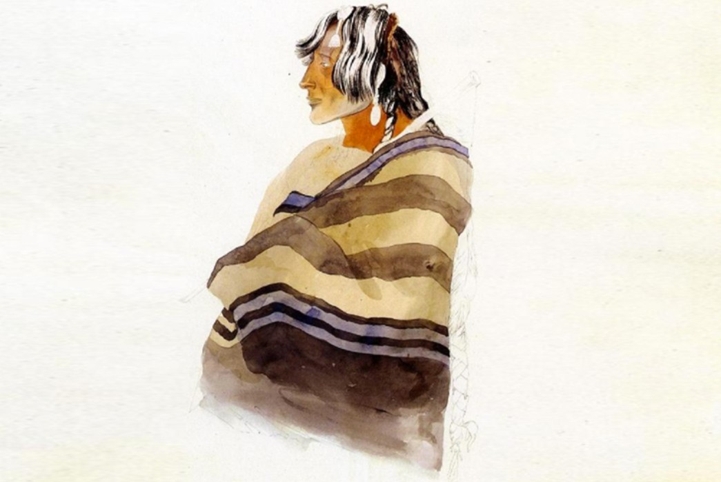 Navajo-Blankets-and-Rugs-Kiasax-1833-watercolour-painting-of-a-Piegan-Blackfoot-wearing-a-Chief's-blanket.-Painting-by-Karl-Bodmer.-Image-via-Wiki-Art