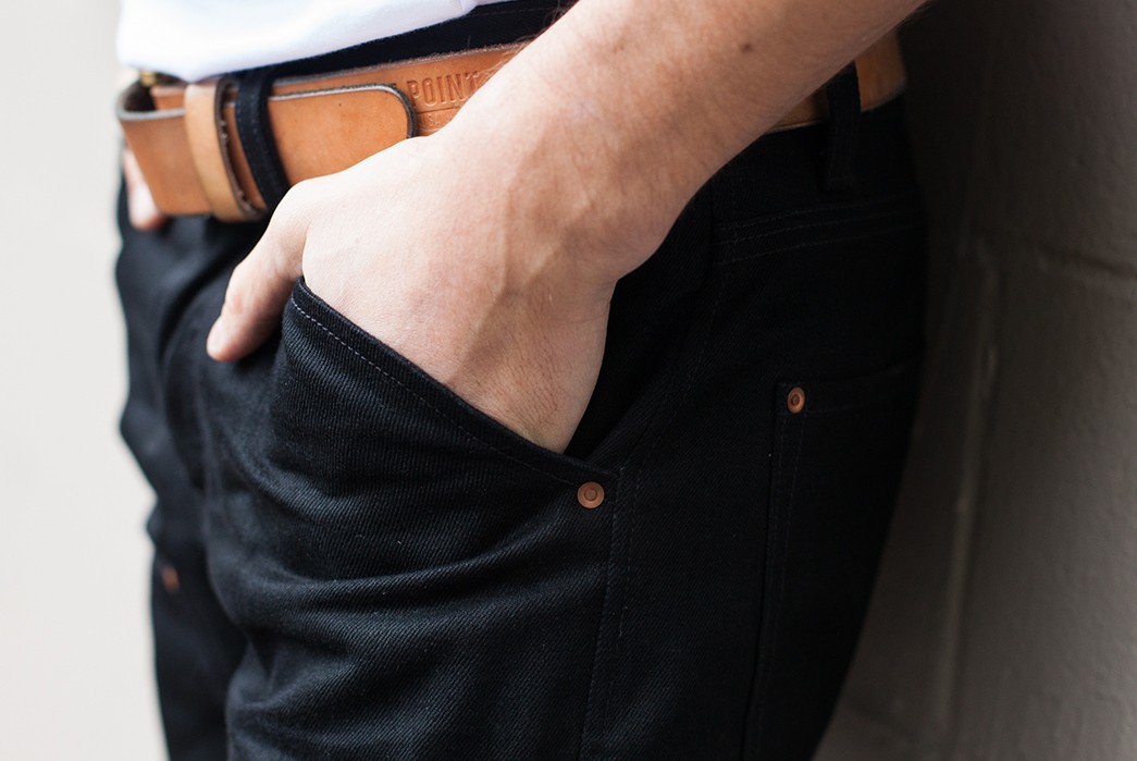 Grease-Point-Workwear's-Newest-Work-Jean-is-Double-Black-and-Double-Kneed-model-side-hand-in-pockets
