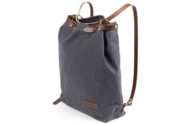 Wood-&-Faulk's-Waxed-Canvas-Shuttle-Pack-is-a-Simple-Twofer-Tote-Backpack-back-side