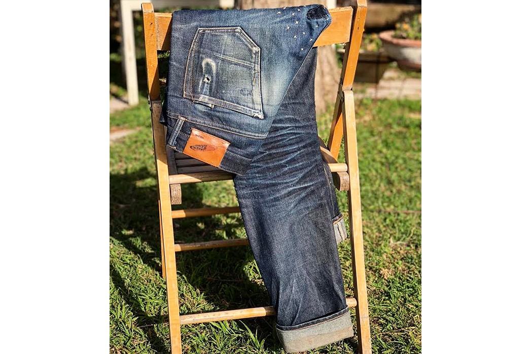 Fade-of-the-Day---Rogue-Territory-Stanton-(11-Months,-3-Washes)-folded-on-chair