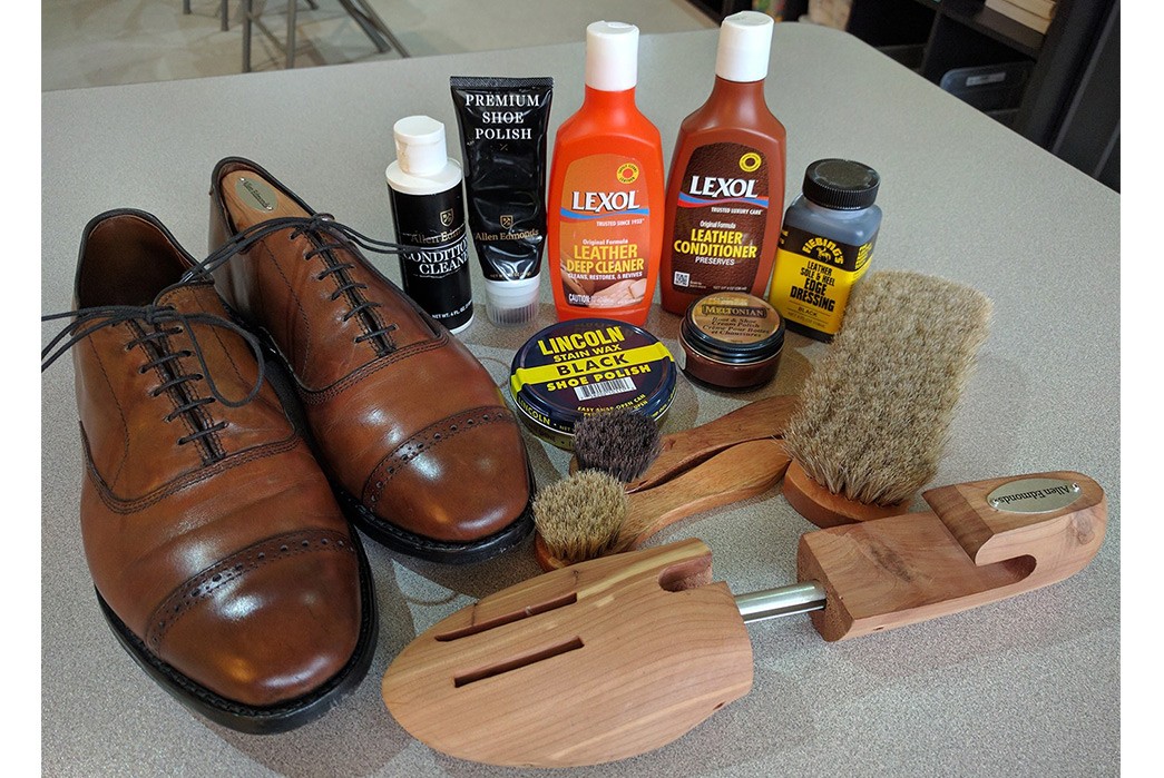 How-to-Protect-Your-Leather-Shoes-from-Rain,-Sleet,-and-Snow-A-pair-of-Allen-Edmunds-shoes-and-an-array-of-care-products-via-Half-Soles