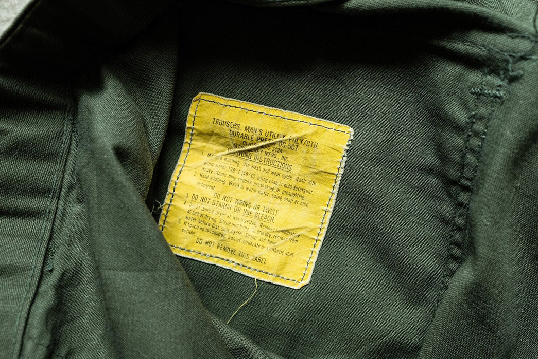The telltale yellow tag of the OG-507s. Image Via Saunders Militaria