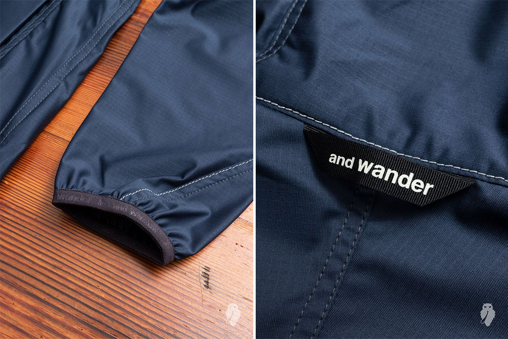 And-Wander-Raschel-Ripstop-Rain-Jackets-blue-sleeve-and-brand