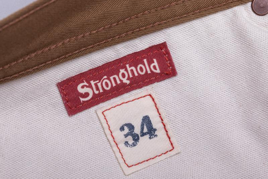 Tradition-Distilled-With-The-Stronghold's-Herringbone-Heritage-Pant-inside-brand-with-number