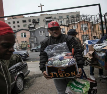 Mutual-Aid---How-to-Build-and-Help-Your-Community-Image-via-Jack-Arts-Volunteers-at-Brooklyn s-St-Stephen-Outreach-carry-food-donations.-Image-via-The-Guardian