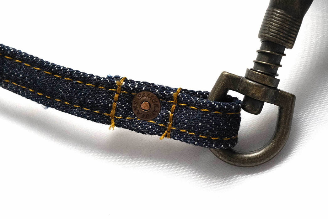 Samurai-Wields-a-17-oz.-Denim-Tool-Bag-buckle-and-button