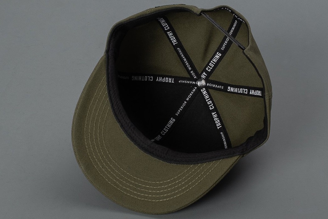 Trophy-Applies-Its-Robust-No.-8-Canvas-To-Its-Superior-Logo-Tracker-Cap-inside
