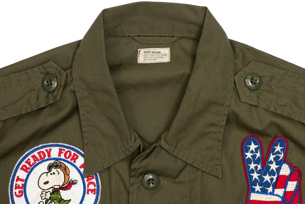 Buzz-Rickson's-Adorns-Its-Tropical-Combat-Jacket-With-Peanuts-Patches-front-top-closed