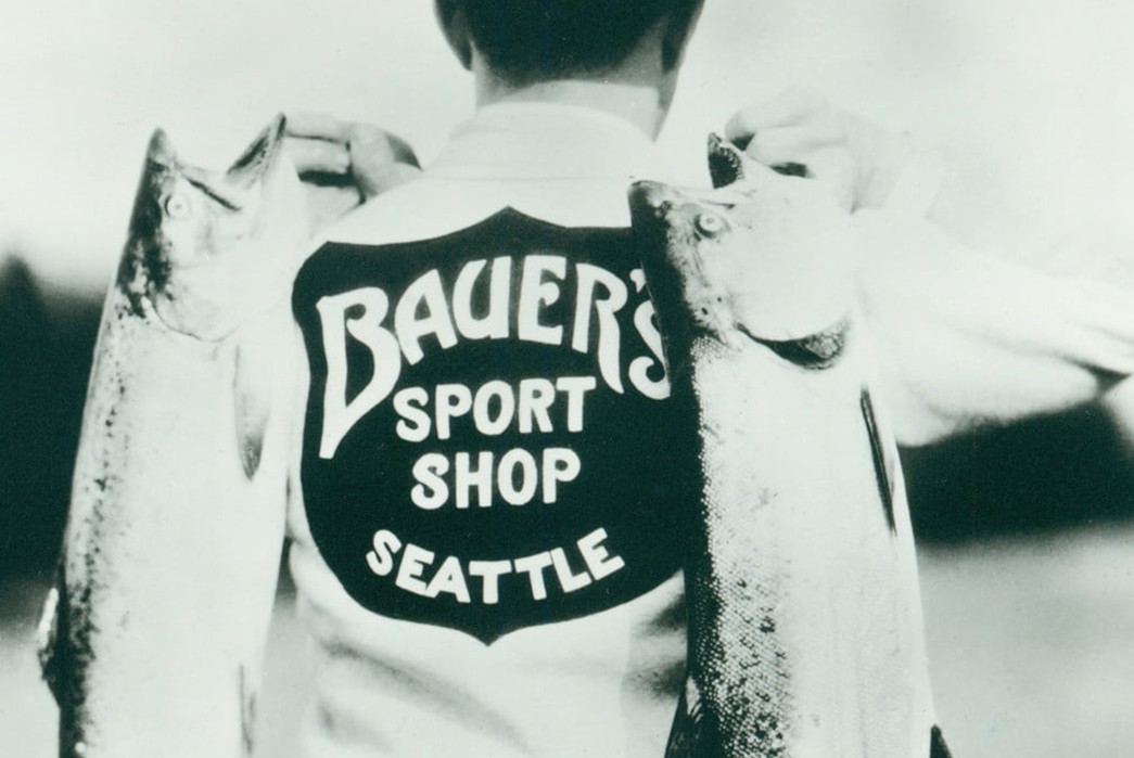 Eddie-Bauer---Getting-Down-With-An-Outerwear-Icon-Bauer-wearing-a-sweater-fitted-with-felt-embroidery-advertising-his-company