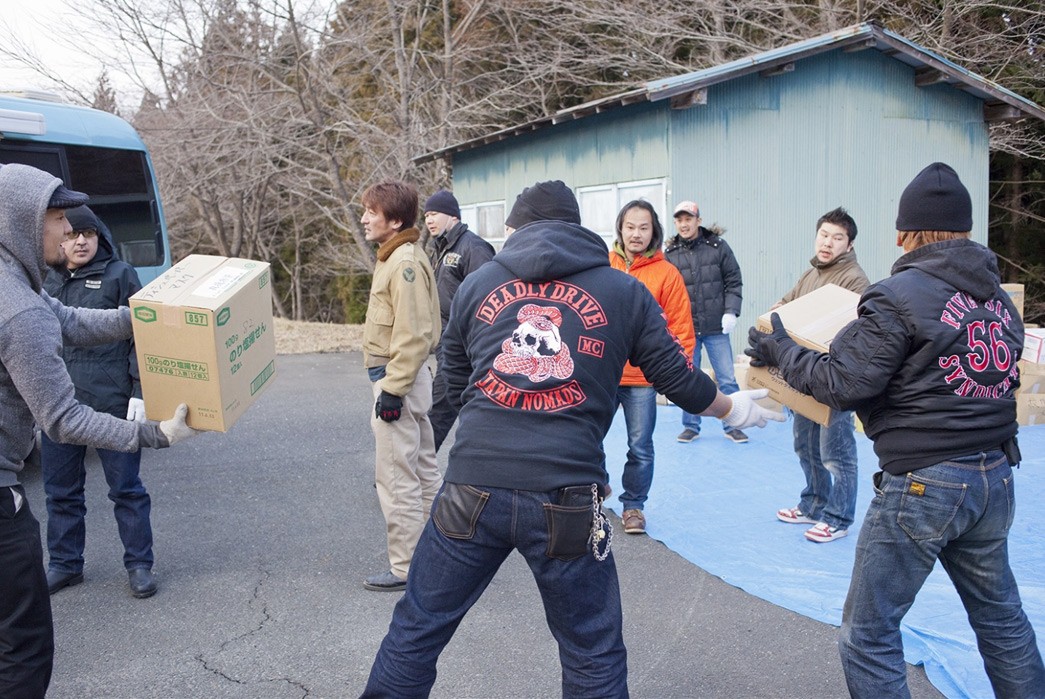 Eric-Kvatek-on-the-10-Year-Anniversary-of-the-Fukushima-Disaster-carring-boxes