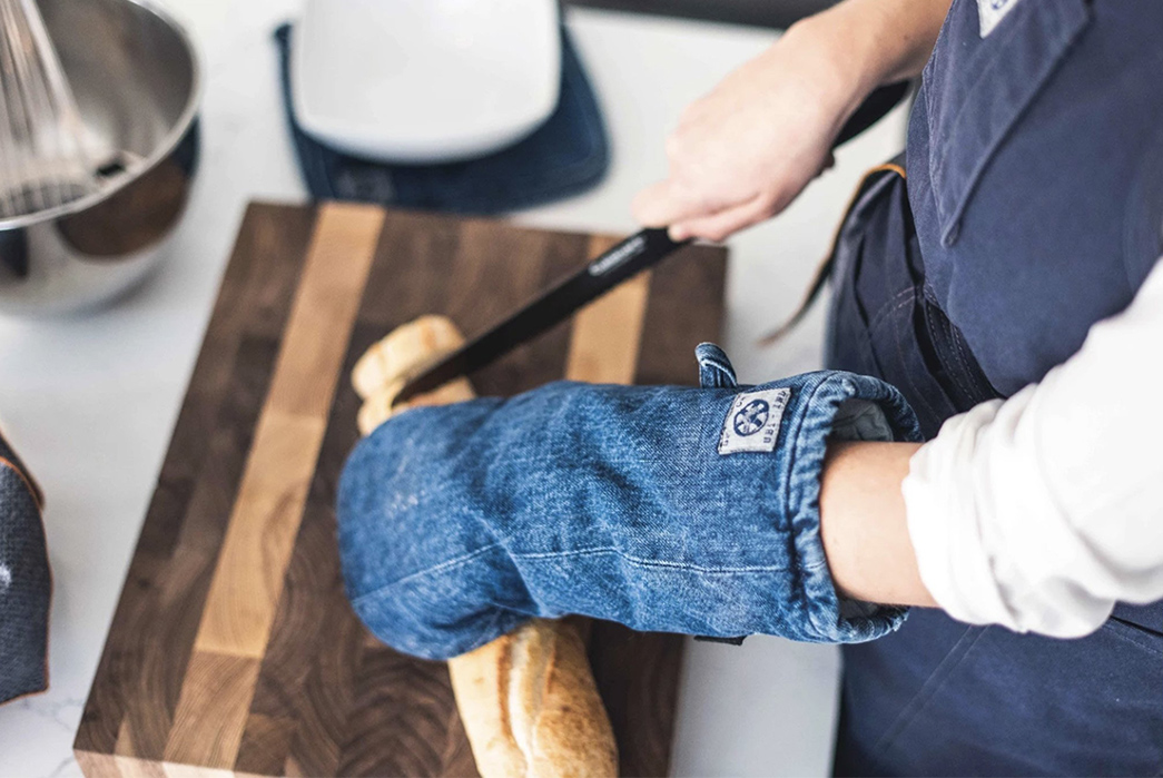 Cook-Up-Some-Fades-With-This-Denim-Oven-Mitt-From-American-Trench-light-bluemodel-cuting-bread