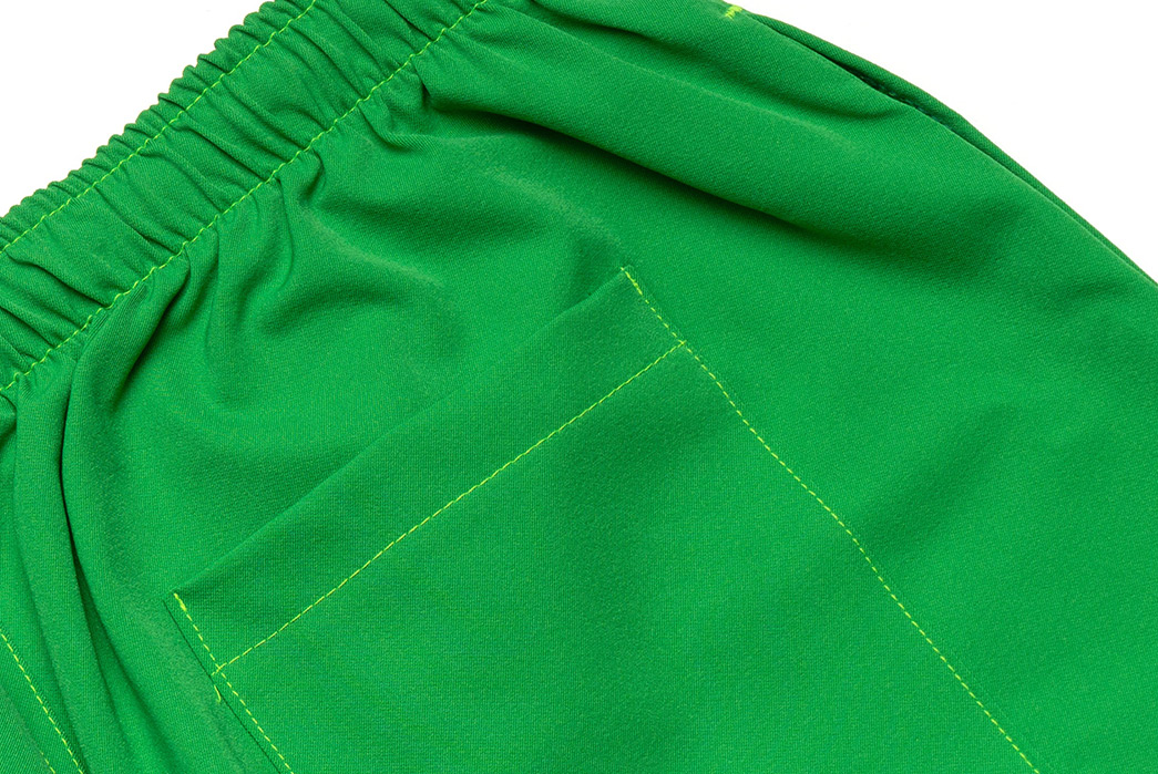 Dive-Into-American-Trench's-Two-Way-Swim-Shorts-green-pockets