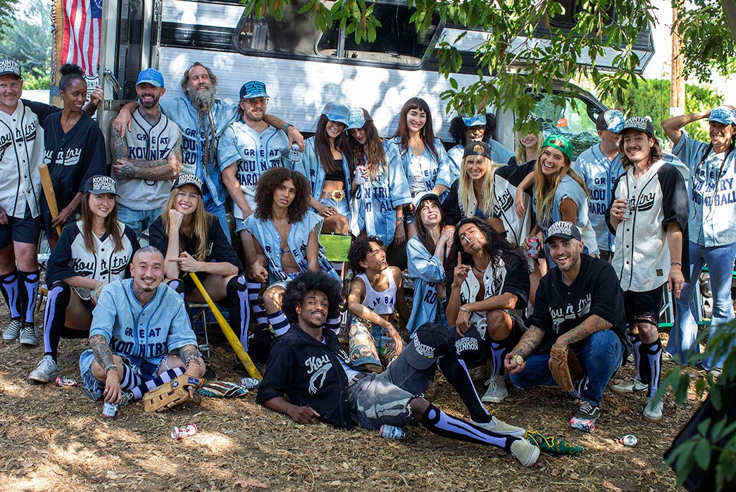 Eric-Kvatek-Creates-'Hippie-Baseball'-Teams-For-Latest-Kapital-Kountry-Shoot-people-in-a-front-of-camper
