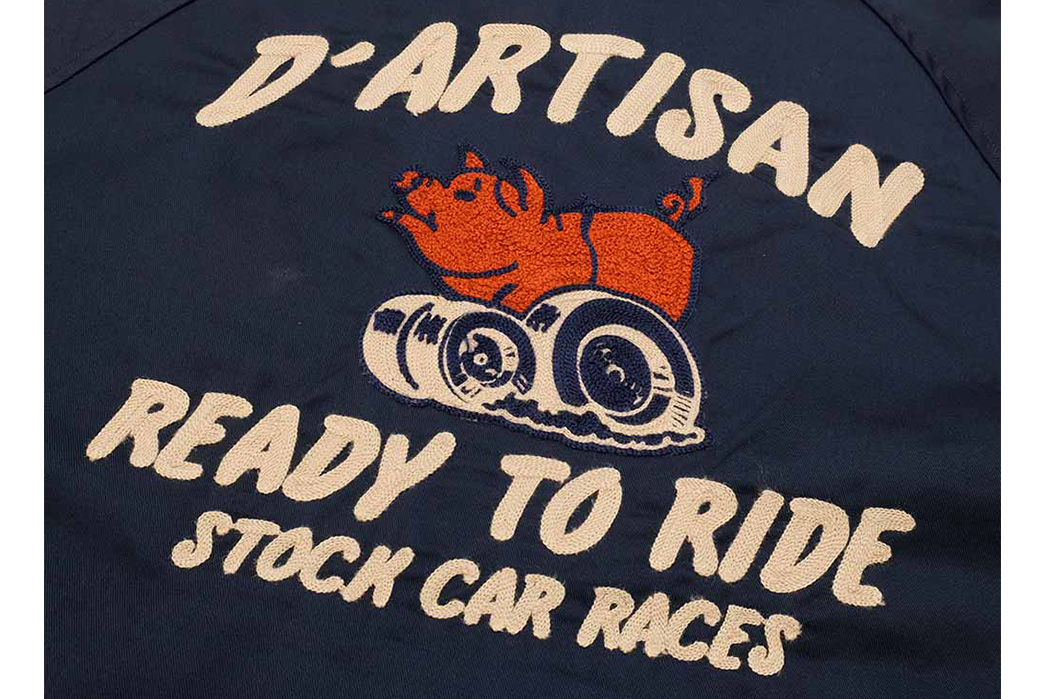 Studio-D'Artisan-Keeps-The-Great-Graphics-Comin'-With-Its-Stock-Car-Races-Coach-Jacket-blue-back-brand