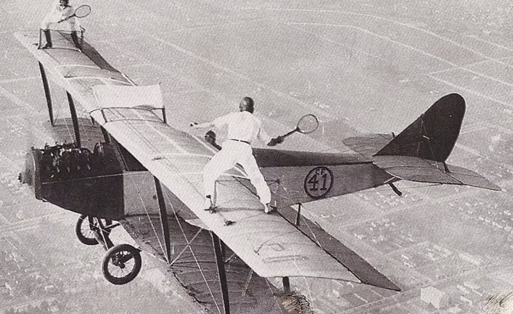 Moments-In-Time---The-Barnstormer-Jacket-Barnstormers-playing-tennis-whilst-wing-walking,-via-Redbull