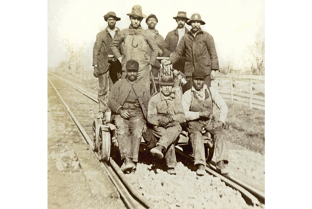 Beyond-The-Tracks---How-American-Railroading-Impacted-American-Workwear-Pt.-1-An-unidentified-section-gang-on-a-handcar,-ca.-1900-1910.-Image-via-Fine-Art-America.