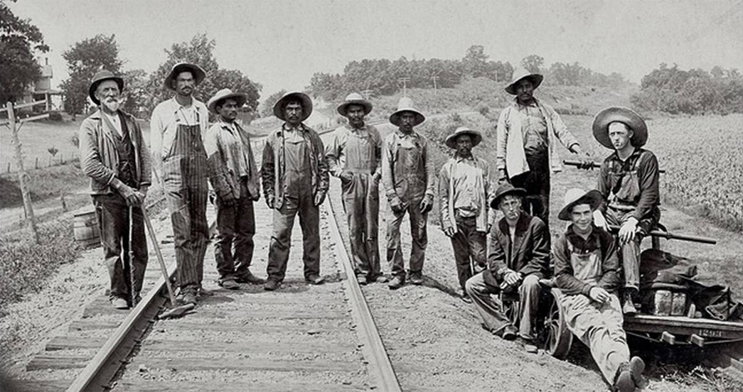 Beyond-The-Tracks---How-American-Railroading-Impacted-American-Workwear-Pt.-1-Mexican-American-track-workers-form-part-of-a-section-gang-ca.1900.-Like-their-American-and-Canadian-counterparts