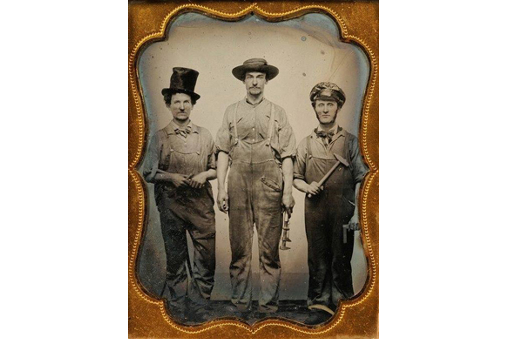 Beyond-The-Tracks---How-American-Railroading-Impacted-American-Workwear-(TBC)-These-unidentified-tradesmen-are-showcasing-some-typical-overalls-of-the-mid-19th-century.-Image-via-South-Union-Mills.