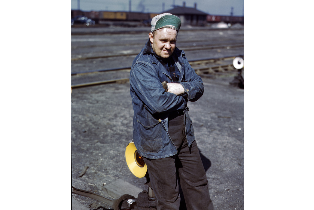 Beyond-The-Tracks---How-Railroading-Impacted-American-Workwear-Pt.-2-A.-S.-Gerdee,-a-switchman,-stands-for-a-photo-in-an-Illinois-railyard,-February-1943.-Image-via-Jack-Delano-Shorpy.com.