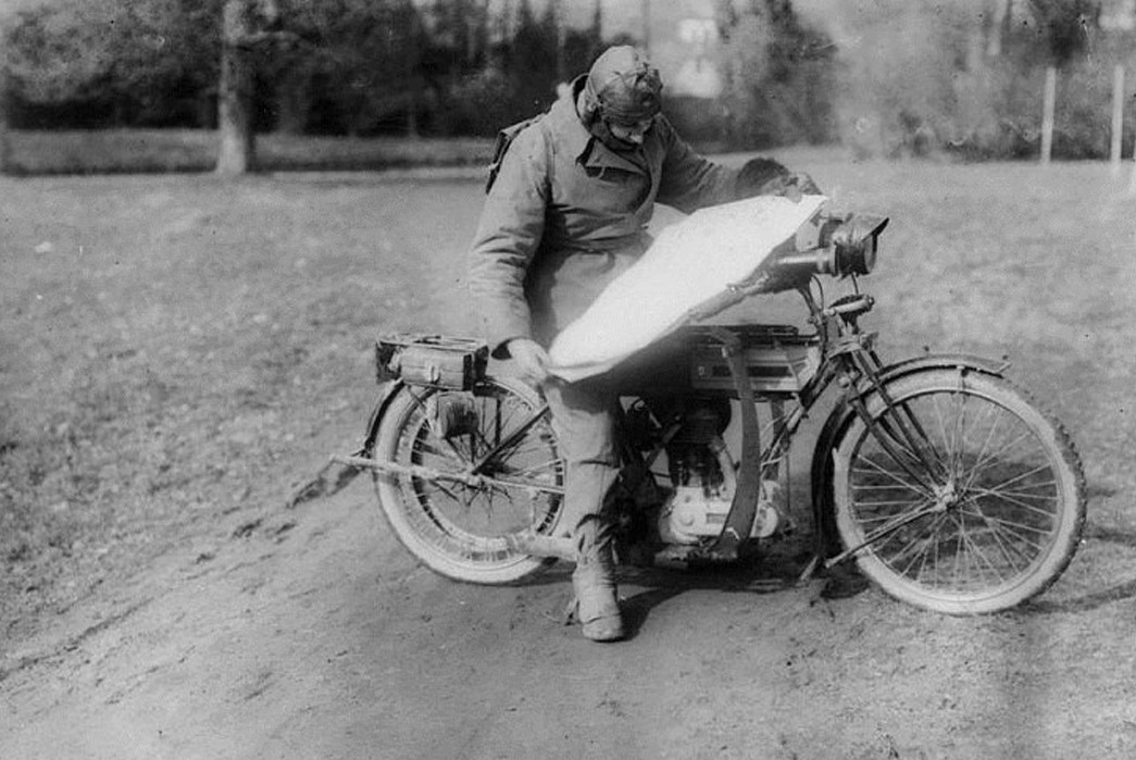 The-Gentleman-Biker-Workwear-That-May-Revitalize-a-Subculture-A-British-military-dispatch-rider-reads-a-map-atop-his-Trusty-Triumph.