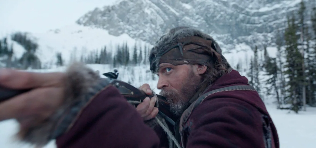 The-History-Of-Winter-Workwear-Hats-John-Fitzgerald,-played-by-Tom-Hardy,-sports-this-fur-cap-while-aiming-down-the-sight-of-his-flintlock.-Image-via-Twentieth-Century-Fox-Associated-Press.