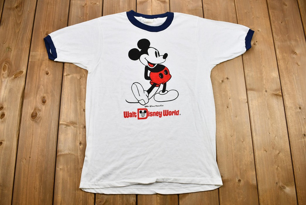 History-&-Evolution-of-the-Graphic-Tee-Mickey-Mouse-was-featured-on-the-first-ever-licensed-graphic-tee.-Image-via-Etsy.