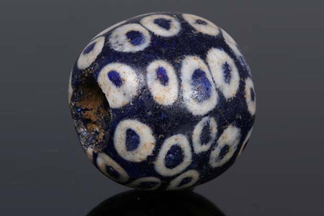 All-About-Trade-Beads---Shiny-Glass-with-a-Dark-Past-A-stratified-eye-bead-from-ancient-Greece.-Image-via-Ancient-Glass-Beads.com.
