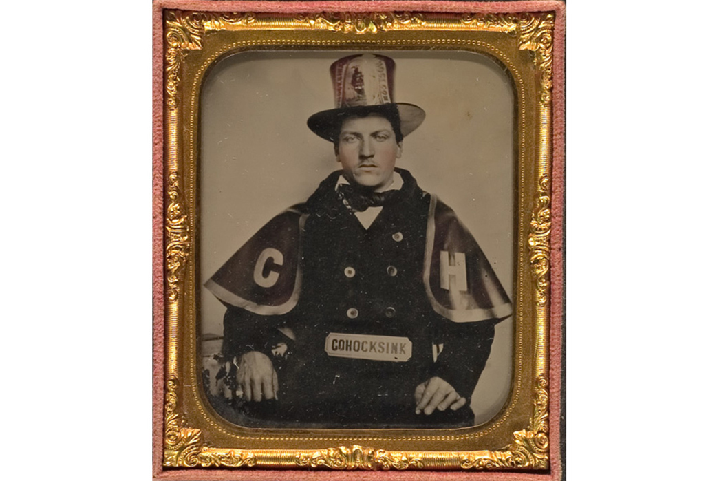 The-History-of-Varsity-Jackets-A-1850s-era-fireman-of-Cohocksink,-Pennsylvania-wears-his-town's-letters-on-his-cape.-Image-via-LotSearch.