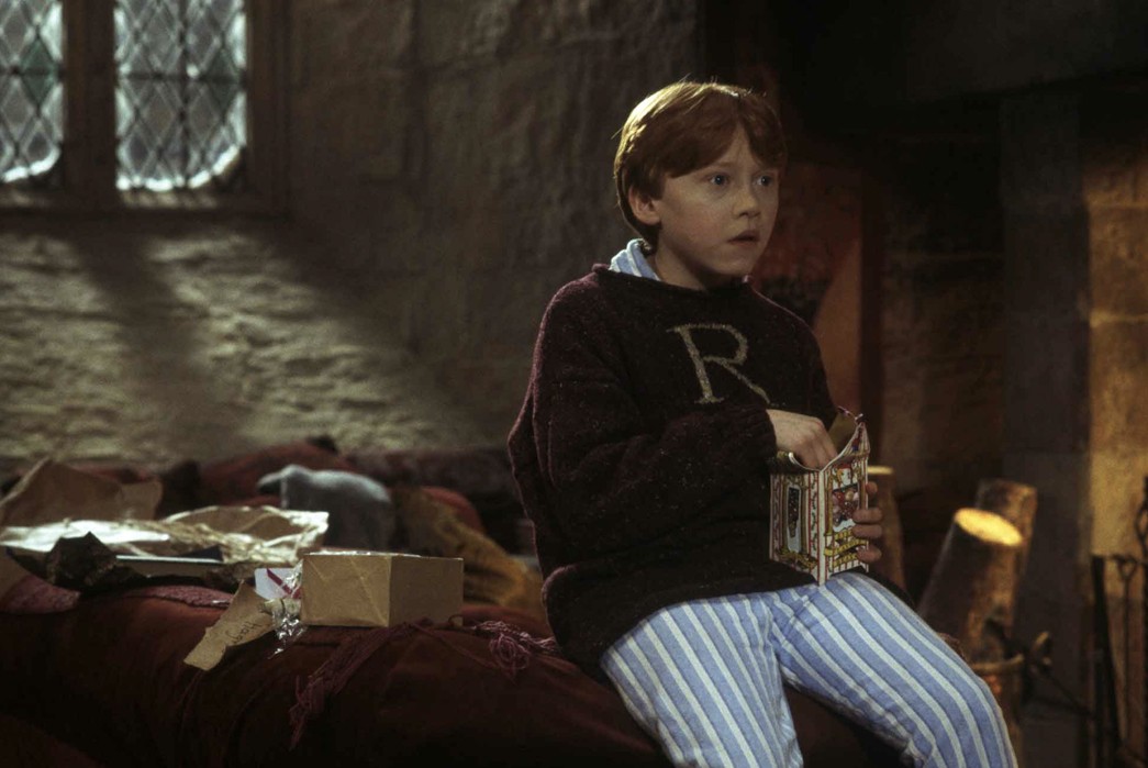 History-of-Pajamas---Title-TBD-Ron-Weasly-sporting-a-monogrammed-boatneck-wool-jumper-over-his-PJs-via-wizardingworld.com