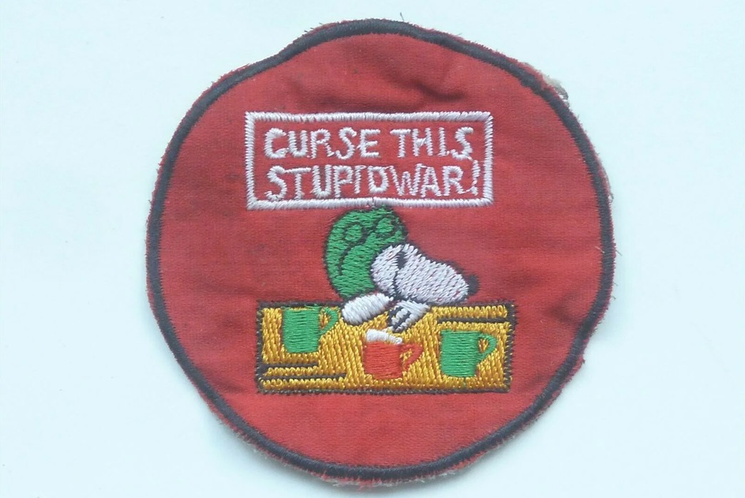 Happiness-is-a-Warm-Puppy---A-History-of-Peanuts-A-Vietnam-War-era-Snoopy-patch-via-Working-Title-Clothing