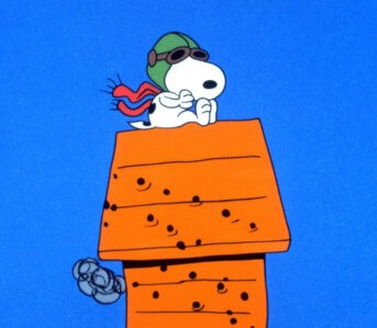 Happiness-is-a-Warm-Puppy---A-History-of-Peanuts-Snoopy-in-mid-flight-on The-Charlie-Brown-and-Snoopy-Show, 1983-85-via-Vanity-Fair