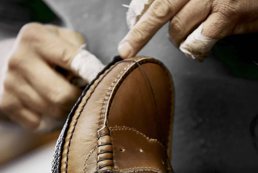 The-Maine-Attraction-All-About-Leather-Footwear-Being-Made-in-Maine-Hand-finishing-the-welt-on-a-pair-of-Quoddy-loafers.-Image-via-Quoddy.