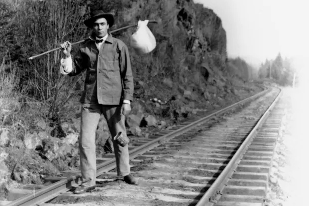 The-History-of-the-Backpack-A-hobo,-or-hobo-stand-in,-carries-his-bindle-stick-for-the-camera.-Image-via-The-San-Bernardino-Sun.